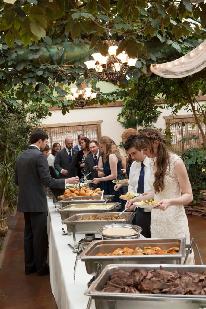 Bride and wedding guests enjoying a Bella Vita buffet